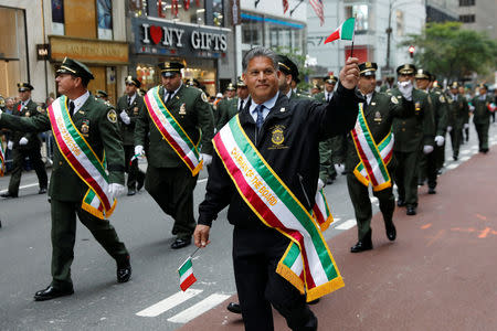 Sanitation workers take part in the 74th Annual Columbus Day Parade in Manhattan, New York, U.S., October 8, 2018. REUTERS/Shannon Stapleton