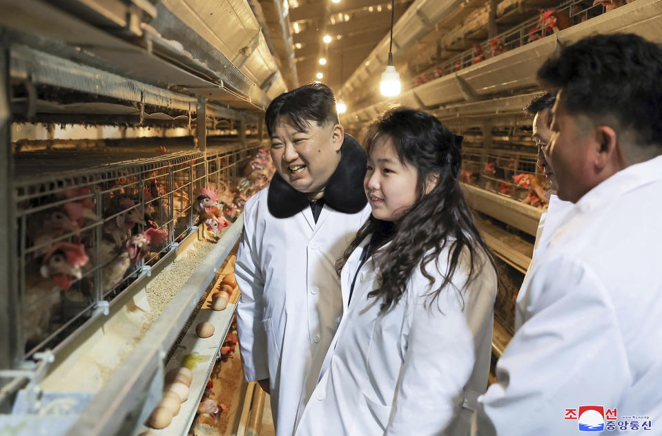 In this photo provided on Monday, Jan. 8, 2024, by the North Korean government, North Korean leader Kim Jong Un, center, with his daughter visits a newly-built chicken farm in Hwangju County of North Hwanghae Province on Jan. 7, 2024. Independent journalists were not given access to cover the event depicted in this image distributed by the North Korean government. The content of this image is as provided and cannot be independently verified. Korean language watermark on image as provided by source reads: "KCNA" which is the abbreviation for Korean Central News Agency. (Korean Central News Agency/Korea News Service via AP)