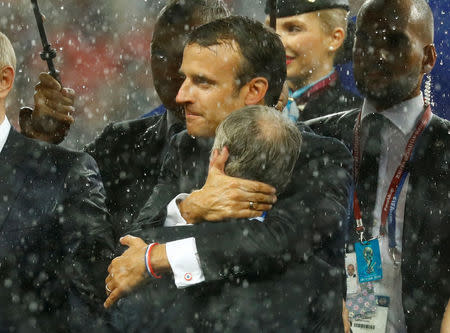 Soccer Football - World Cup - Final - France v Croatia - Luzhniki Stadium, Moscow, Russia - July 15, 2018 France coach Didier Deschamps celebrates with President of France Emmanuel Macron after winning the World Cup REUTERS/Kai Pfaffenbach