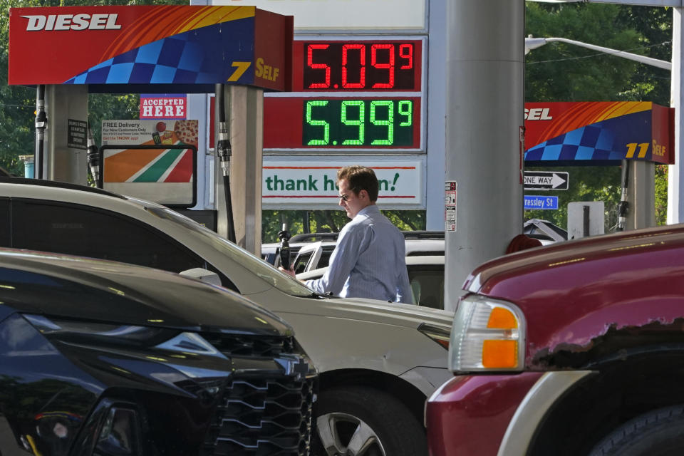 FILE - A man pumps gas at a mini-mart in Pittsburgh on June 15, 2022. As the challenges confronting President Joe Biden intensify, his predictions of a rosy political future for the Democratic Party are growing bolder. The assessments, delivered in speeches, fundraisers and conversations with friends and allies, seem at odds with a country that he acknowledged this week was “really, really down,” burdened by a pandemic, surging gas prices and spiking inflation. (AP Photo/Gene J. Puskar, File)