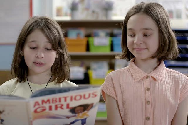 <p>Paramount+ / MTV Documentary Films</p> Two students read 'Ambitious Girl' by Meena Harris in the documentary 'The ABCs of Book Banning'