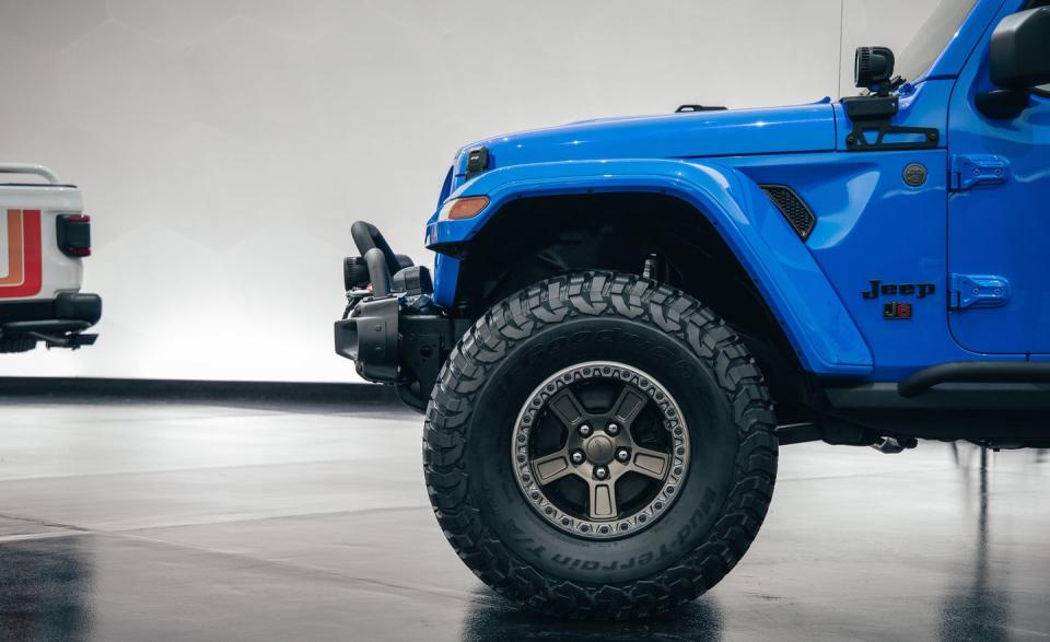 <p>The silver and Brass Monkey wheel colors provide contrast with the Metallic Brilliant Blue paint, which was originally offered on the 1978 Jeep Honcho truck.</p>