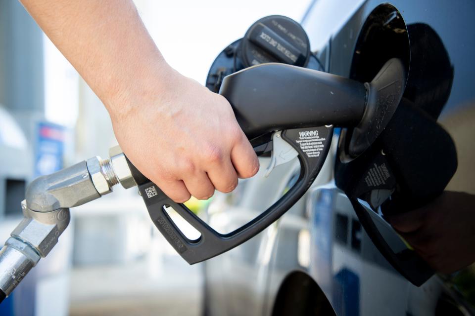 A man pumps gas at a Tallahassee gas station.