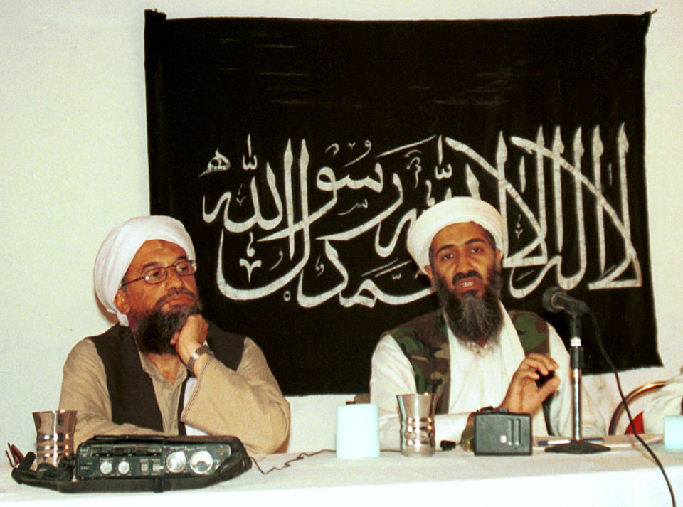 FILE - In this 1998 file photo made available Friday, March 19, 2004, Ayman al-Zawahri, left, holds a press conference with Osama bin Laden in Khost, Afghanistan. Al-Qaida's central leadership broke with one of its most powerful branch commanders, who in defiance of its orders spread his operations from Iraq to join the fighting in Syria and fueled bitter infighting among Islamic militant factions in Syria’s civil war. The break, announced in a statement Monday, appeared to be an attempt by Al-Zawahri, to establish control over the feuding militant groups in Syria and stem the increasingly bloody reprisals among them. (AP Photo/Mazhar Ali Khan, File)