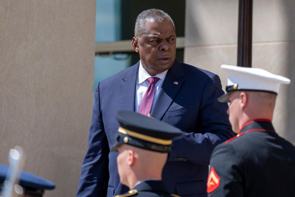 Secretary of Defense Lloyd Austin waits to greet Poland's Deputy Prime Minister and Minister of National Defense Mariusz Blaszczak during an honor cordon ceremony, upon his arrival at the Pentagon, Friday, May 5, 2023, in Washington.