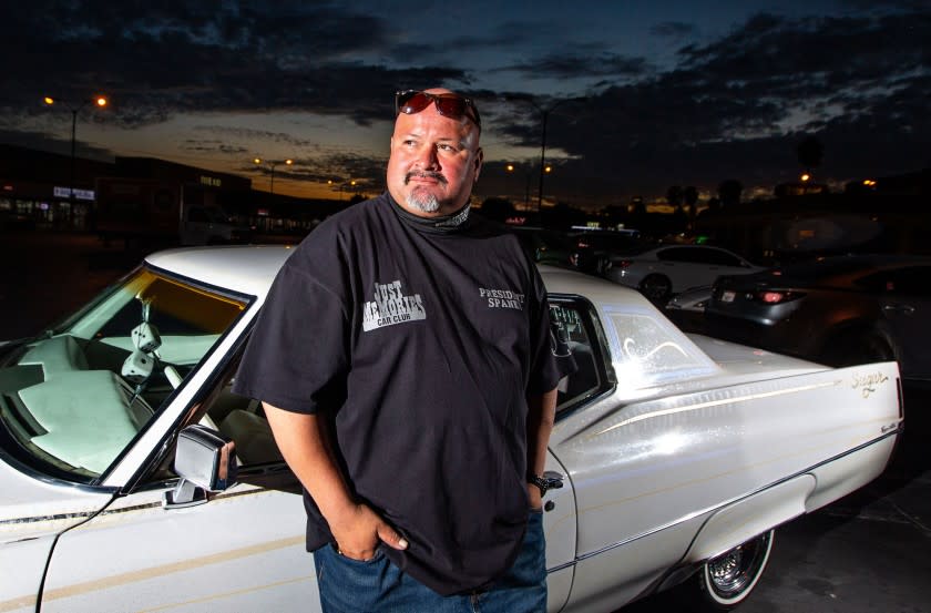 LOS ANGELES, CA - AUGUST 13: Juan Jose Ramirez, 39, of Bladwin Park poses a portrait in front of his lowrider in East Los Angeles on Thursday, Aug. 13, 2020 in Los Angeles, CA. (Jason Armond / Los Angeles Times)