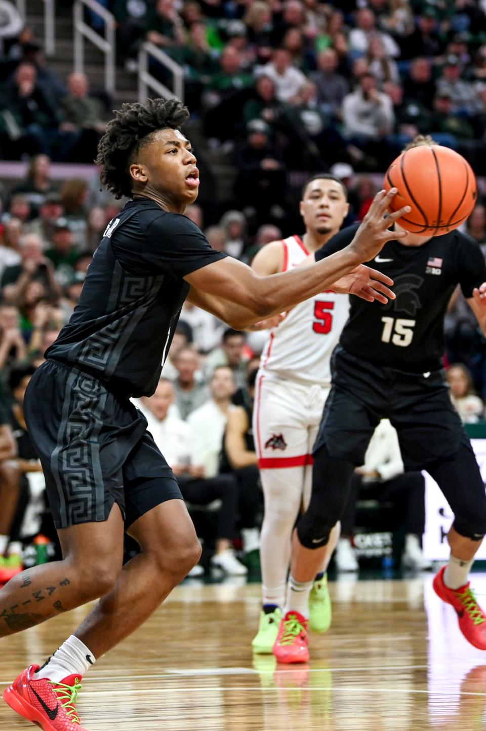 Michigan State's Jeremy Fears Jr. passes the ball against Stony Brook during the second half on Thursday, Dec. 21, 2023, at the Breslin Center in East Lansing.