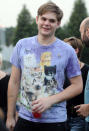 Grant Mayland of Minneapolis wears a shirt decorated with cats while he waits for the start of the Walker Art Center's first "Internet Cat Video Film Festival," showcasing the best of cat films on the Internet in Minneapolis Thursday, Aug. 30, 2012. The Walker Art Center in Minneapolis held its first-ever online cat video festival, a compilation of silly cat clips that have become an Internet phenomenon, attracting millions of viewers for some of the videos. (AP Photo/Craig Lassig)