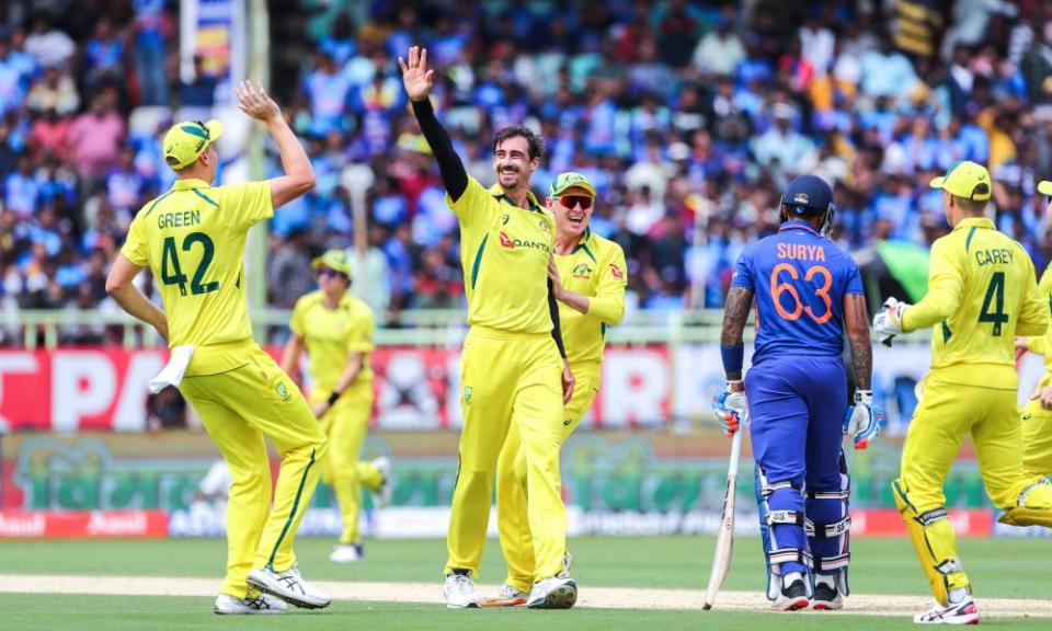 Australia’s Mitchell Starc, centre, celebrates the wicket of India’s Suryakumar Yadav during the second one-day international cricket match between India and Australia, in Visakhapatnam, India