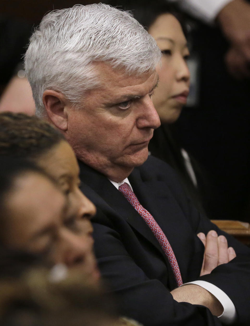 Suffolk County District Attorney Daniel F. Conley, center, is seated in the gallery during closing arguments in the double murder trial for former New England Patriots tight end Aaron Hernandez at Suffolk Superior Court, Thursday, April 6, 2017, in Boston. Hernandez is on trial for the July 2012 killings of Daniel de Abreu and Safiro Furtado who he encountered in a Boston nightclub. The former NFL player is already serving a life sentence in the 2013 killing of semi-professional football player Odin Lloyd. (AP Photo/Steven Senne, Pool)