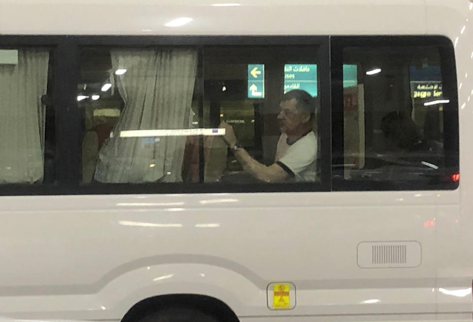 A mariners from the MT Front Altair looks out the window of a bus after leaving Dubai International Airport in Dubai, United Arab Emirates, on Saturday, June 15, 2019, after spending two days in Iran. Associated Press journalists saw the crew members of the MT Front Altair on Saturday night after their Iran Air flight from Bandar Abbas, Iran, landed in Dubai in the United Arab Emirates. The Norwegian-owned oil tanker was attacked Thursday, June 13, in the Gulf of Oman. The U.S. has accused Iran of attacking the Front Altair and another oil tanker with limpet mines. Iran has denied the allegations. (AP Photo/Jon Gambrell)