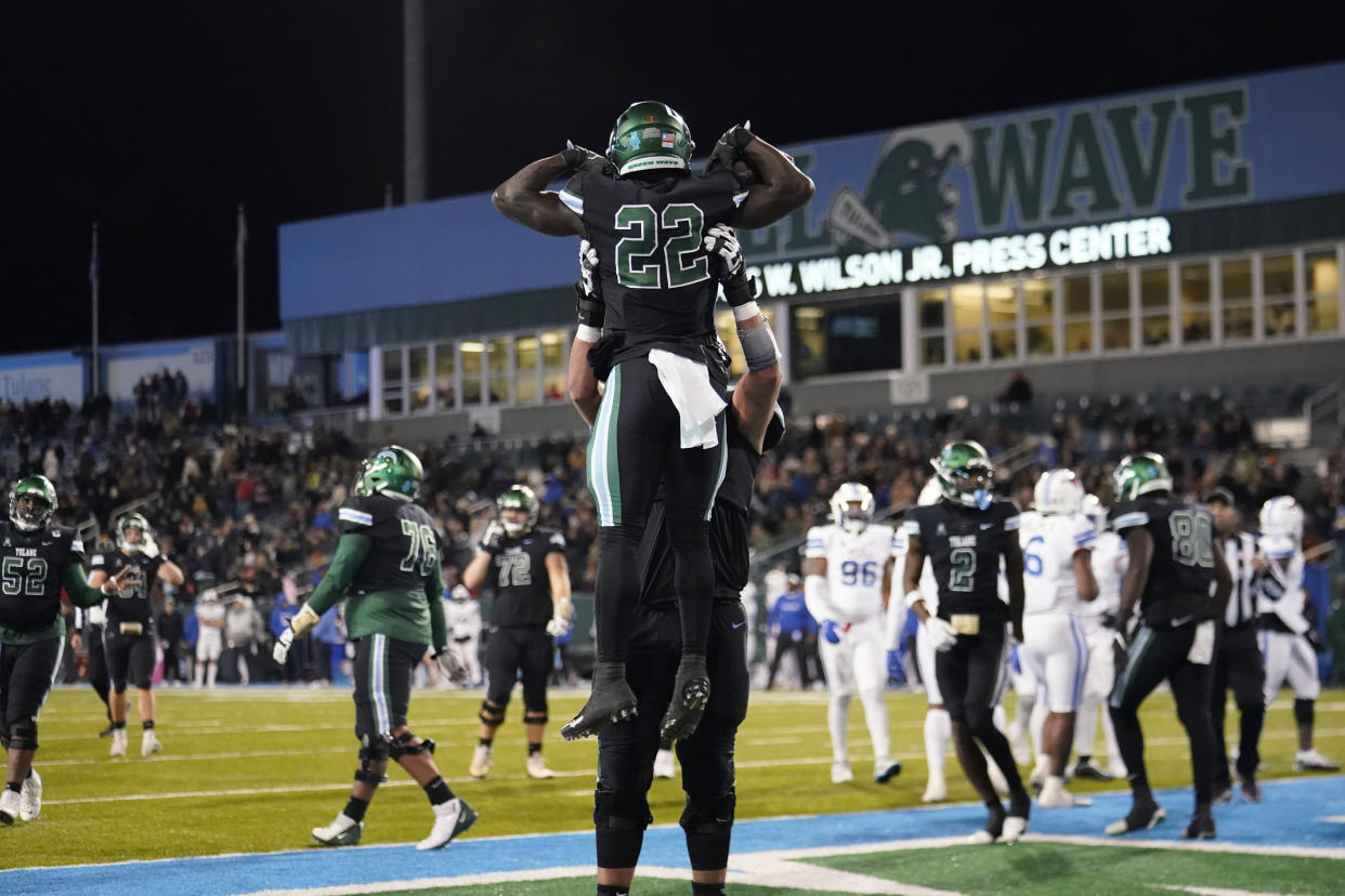 Tulane running back Tyjae Spears (22) celebrates his touchdown carry against Southern Methodist in New Orleans, Thursday, Nov. 17, 2022. Tulane won 59-24. (AP Photo/Gerald Herbert)
