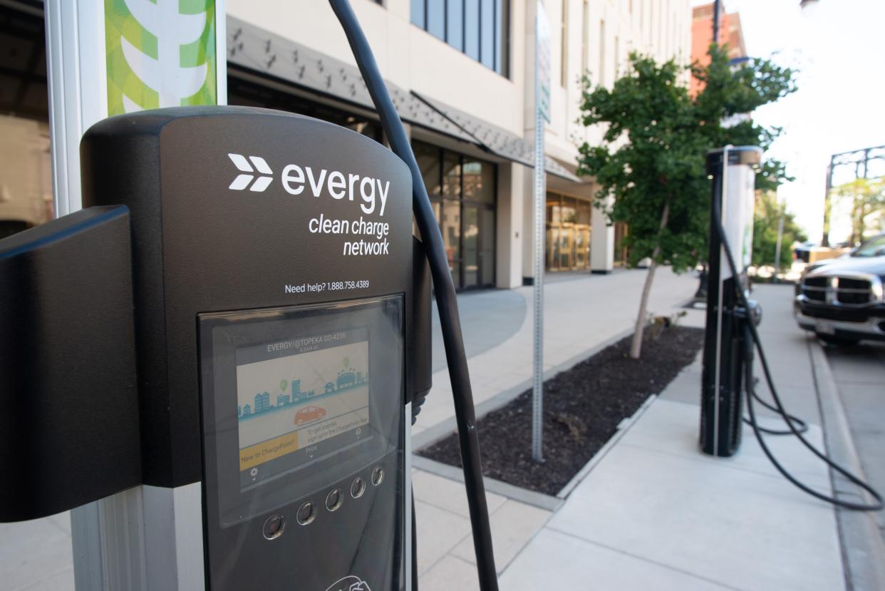 Evergy electric chargers await vehicles in front of the Evergy building downtown off S. Kansas Ave. and 8th Street. File photo.