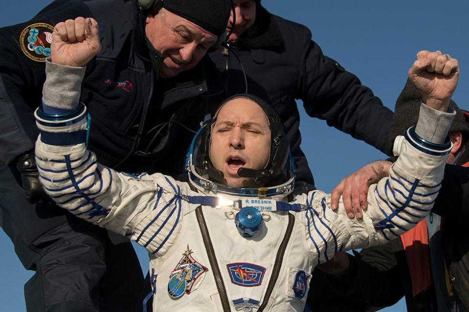 <p>NASA astronaut, Randy Bresnik, is helped out of his spacecraft just minutes after he, European Space Agency astronaut Paolo Nespoli, and Roscosmos cosmonaut Sergey Ryazanskiy arrive near the town of Zhezkagan, Kazakhstan after 139 days in space. The three men served as members of the Expedition 52 and 53 crews onboard the International Space Station.</p>