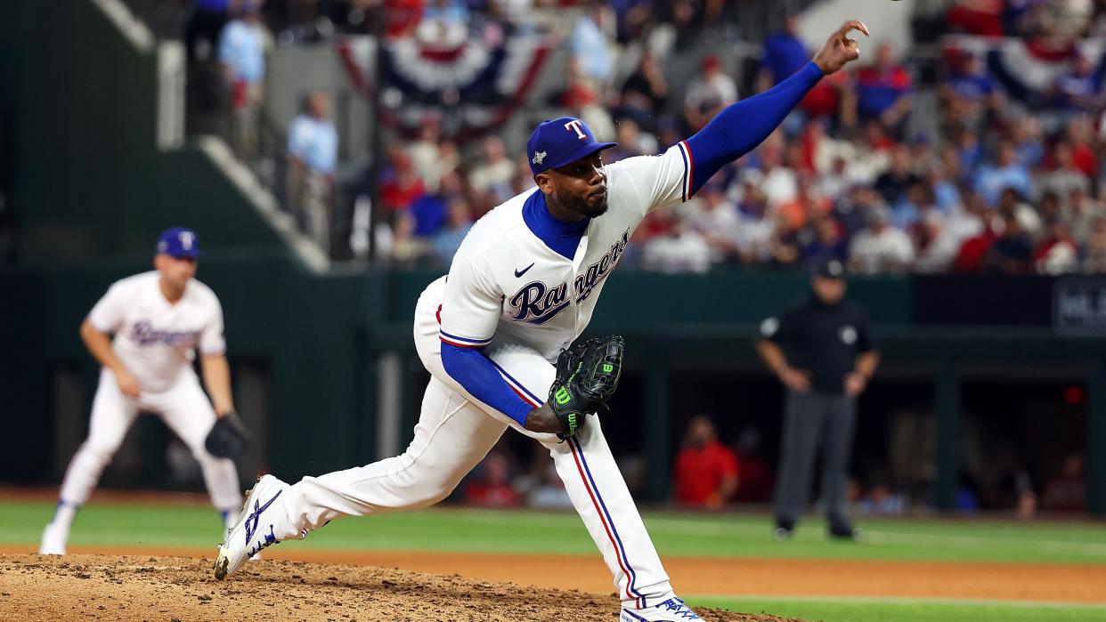  Aroldis Chapman #45 of the Texas Rangers pitches in the eighth inning against the Baltimore Orioles during Game Three of the Division Series at Globe Life Field on October 10, 2023 in Arlington, Texas. 