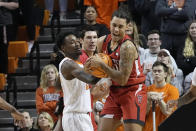 Texas Tech guard Jaylon Tyson. Right, grabs a rebound in front of Oklahoma State forward Kalib Boone, left, in the first half of an NCAA college basketball game Wednesday, Feb. 8, 2023, in Stillwater, Okla. (AP Photo/Sue Ogrocki)