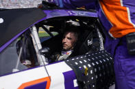 Denny Hamlin gets ready in his car before the start of a NASCAR Cup Series auto race Sunday, Oct. 16, 2022, in Las Vegas. (AP Photo/John Locher)