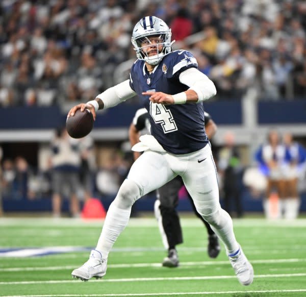 Dallas Cowboys quarterback Dak Prescott scrambles against the Los Angeles Rams on Sunday at AT&T Stadium in Arlington, Texas. Photo by Ian Halperin/UPI