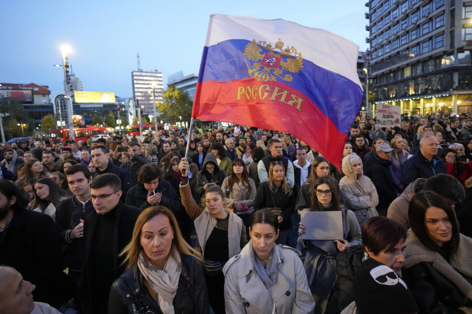 FILE - A woman waves a Russian flag during a pro-Palestinian gathering in Belgrade, Serbia on Nov. 12, 2023. (AP Photo/Darko Vojinovic, File)