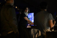 Abigail Rosen Holmes, show director and co-creative director for the band Phish's upcoming show at the Sphere, works in the control booth during rehearsals on Tuesday, April 16, 2024, in Las Vegas. (AP Photo/David Becker)