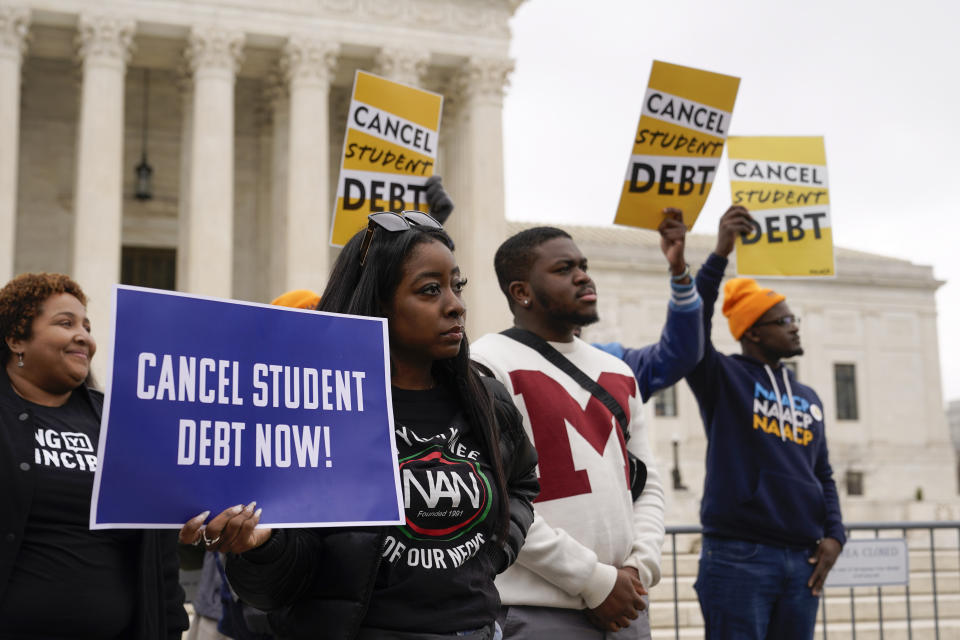 Student debt relief advocates gather outside the Supreme Court on Capitol Hill in Washington, Tuesday, Feb. 28, 2023, as the court hears arguments over President Joe Biden's student debt relief plan. (AP Photo/Patrick Semansky)