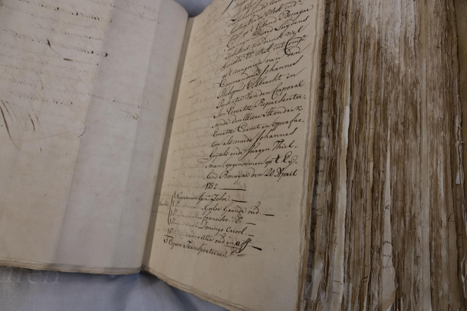 A ledger containing the names of enslaved people is shown at the National Archives in The Hague, Netherlands, Monday, Dec. 19, 2022. The Dutch government is expected to issue a long-awaited formal apology for its role in the slave trade, with a speech by Dutch Prime Minister Mark Rutte, and ceremonies in the former colonies. (AP Photo/Peter Dejong)