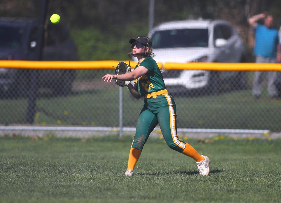 Blackhawk's Lila Grimm throws the ball to third base in an attempt to beat the runner during the third inning against Hampton Wednesday evening at Blackhawk High School.