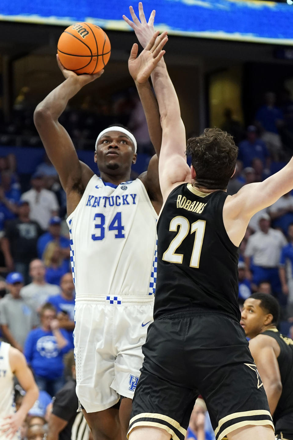 Kentucky forward Oscar Tshiebwe (34) shoots over Vanderbilt center Liam Robbins (21) during the second half of an NCAA college basketball game in the Southeastern Conference men's tournament Friday, March 11, 2022, in Tampa, Fla. (AP Photo/Chris O'Meara)