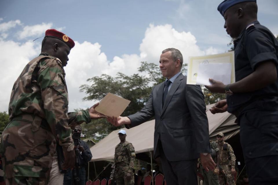 <div class="inline-image__caption"><p>Victor Tokmakov, First Secretary of the Russian Embassy, presents the graduation diplomas to a graduating recruits in Berengo on August 4, 2018. Russian military consultants have set up training for the Central African Armed Forces.</p></div> <div class="inline-image__credit">Florent Vergnes/AFP via Getty Images</div>