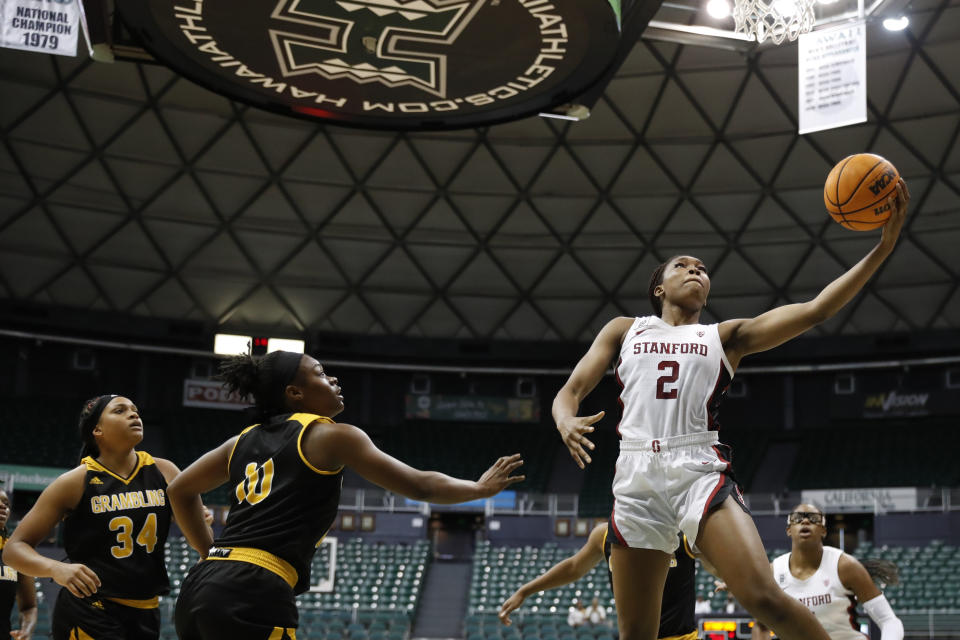 Stanford guard Agnes Emma-Nnopu (2) goes for a layup over Grambling State guard Leah Morrow and guard DeMya Young during the fourth quarter of an NCAA college basketball game, Saturday, Nov. 26, 2022, in Honolulu. (AP Photo/Marco Garcia)