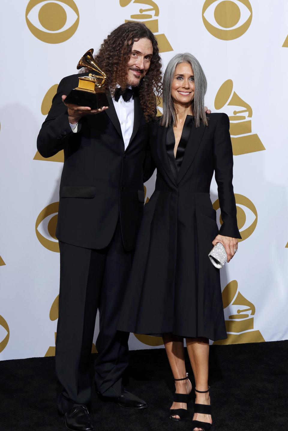 Weird Al Yankovic poses with his award during the 57th annual Grammy Awards in Los Angeles