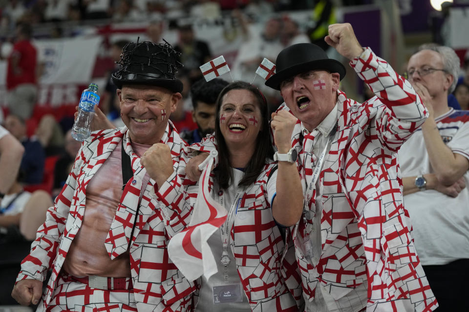 FILE - England fans cheer at the stand prior the World Cup group B soccer match between England and Wales, at the Ahmad Bin Ali Stadium in Al Rayyan , Qatar, Tuesday, Nov. 29, 2022. (AP Photo/Frank Augstein, File)