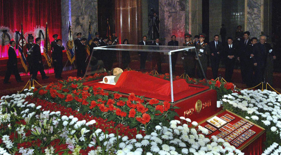 FILE - In this photo released on Dec. 20, 2011 by the Korean Central News Agency and distributed in Tokyo by the Korea News Service, the body of North Korean leader Kim Jong Il is laid in the Kumsusan Memorial Palace in Pyongyang, North Korea. North Korea’s Kim Jong Un's train journey to Russia has a storified history. The tradition of train travel extends across the generations. That’s in evidence at the massive Kumsusan Palace of the Sun, where reconstructions of Kim Jong Un’s father’s and grandfather’s train cars, and the leaders’ preserved and displayed remains, are enshrined. (Korean Central News Agency/Korea News Service via AP, File)