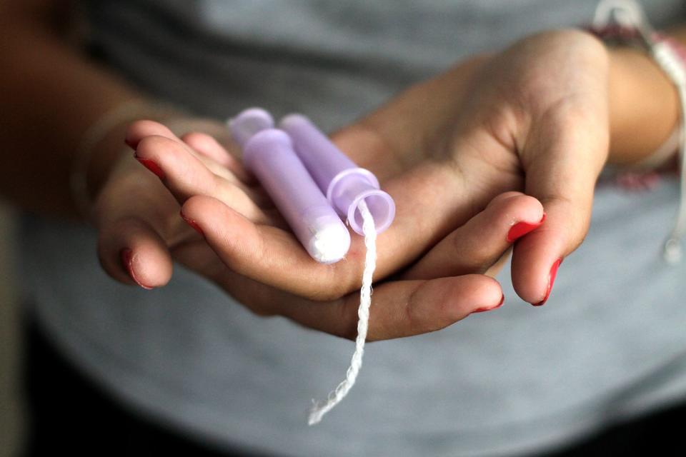 <p>Getty</p> Stock image of tampons in a woman