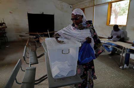 A woman casts her vote during presidential election, at a polling station in Fatick, Senegal February 24, 2019. REUTERS/Zohra Bensemra