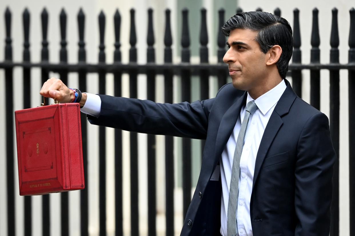 <p>Chancellor Rishi Sunak, holds the budget box before delivering the annual Budget at 11 Downing Street</p> (Getty Images)