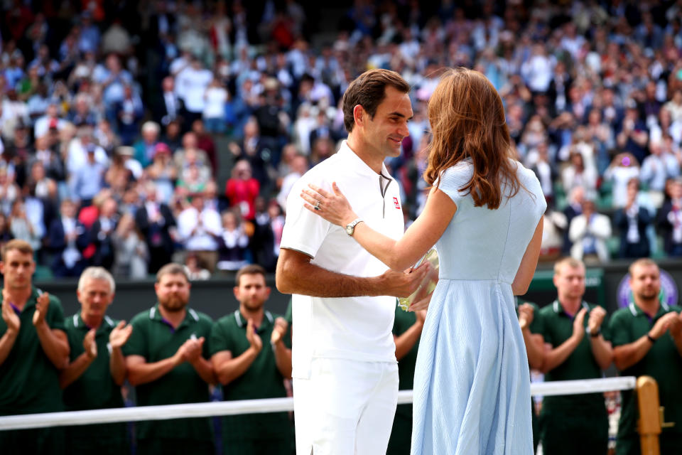 Kate presented friend Roger Federer with the runners-up trophy at Wimbledon 2019. Federer and his wife went to Kate's sister's wedding, and Prince George has had coaching from the former number one. (Clive Brunskill/Getty Images)