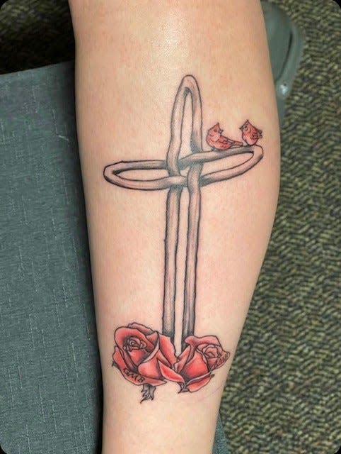 Maddie Backaus's St. Thomas cross tattoo