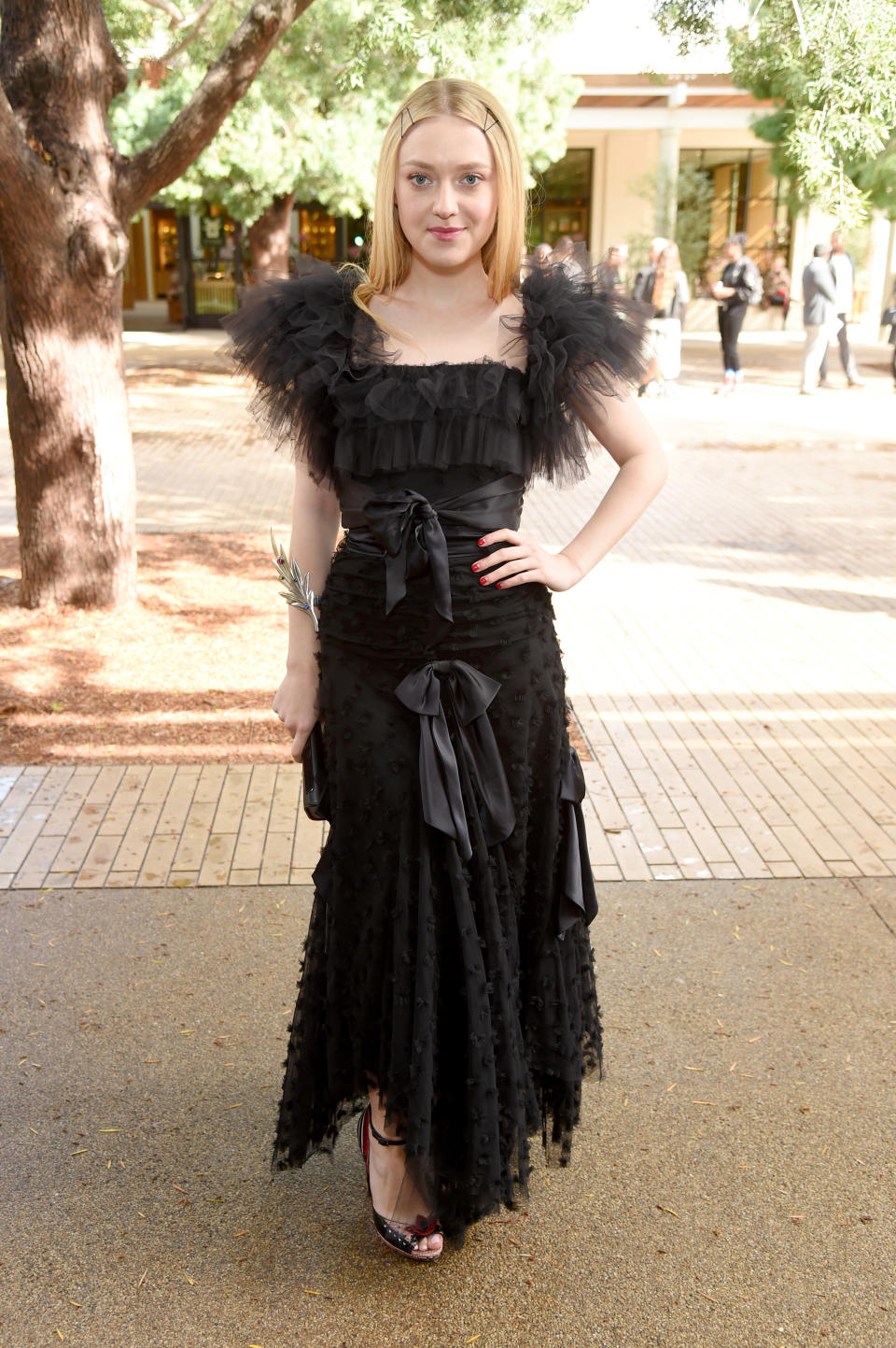 <p>On February 5, Dakota Fanning donned black Rodarte ruffles for the AW19 show in California. <em>[Photo: Getty]</em> </p>