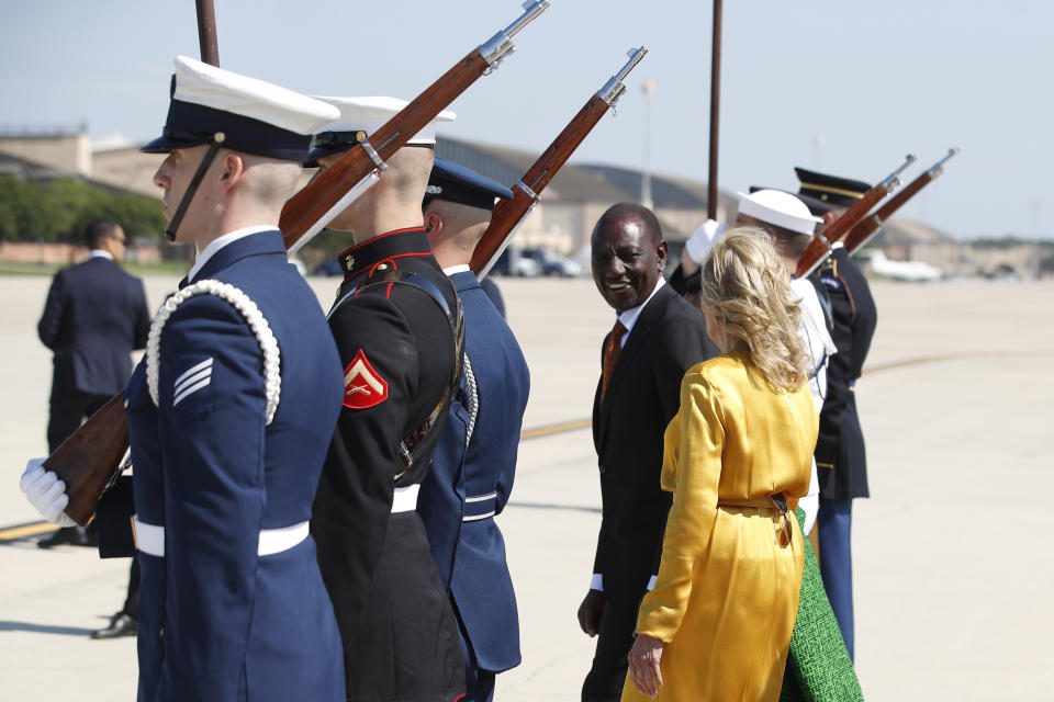 Kenya's President William Ruto, center, and first Lady Jill Biden, right, talk during an arrival ceremony at Andrews Air Force Base, Md., Wednesday, May 22, 2024, during President Ruto's state visit to the United States. (AP Photo/Luis M. Alvarez)