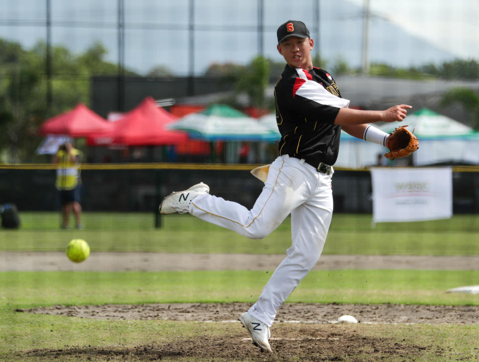 Southeast Asian Games - Men's Softball - Round Robin - Singapore v Philippines - The Villages, Clark, Philippines - December 4, 2019   A Singapore athlete in action during the match   REUTERS/Jeremy Lee