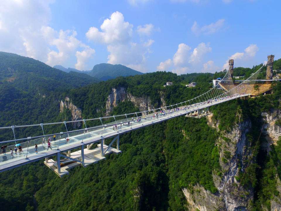 <p>During a series of media events, people were encouraged to try and smash the bridge’s glass panels with a sledge hammer. (Getty Images)<br><br></p>