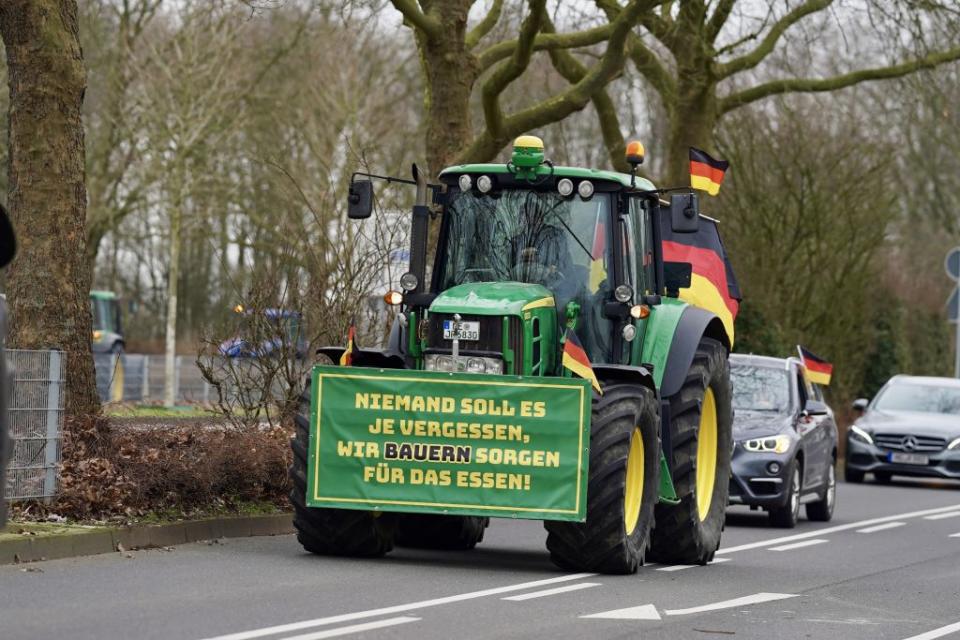 Farmers gather on February 17, 2024, to stage a protest against the coalition government’s agricultural policies as they convoy with tractors and other agricultural vehicles in Dusseldorf, Germany. (Photo by Kadir Ilboga/Anadolu via Getty Images)