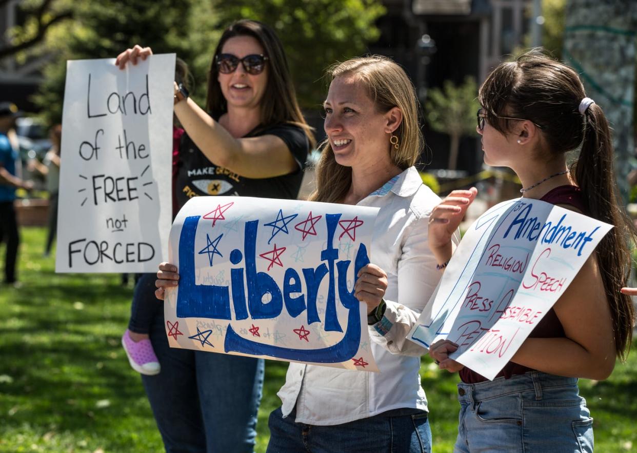 <span class="caption">Protests against mandates and quarantines get the Founding Fathers' ideas wrong.</span> <span class="attribution"><a class="link " href="https://www.gettyimages.com/detail/news-photo/small-group-of-approximately-50-people-hold-open-solvang-news-photo/1222462576?adppopup=true" rel="nofollow noopener" target="_blank" data-ylk="slk:George Rose/Getty Images;elm:context_link;itc:0;sec:content-canvas">George Rose/Getty Images</a></span>