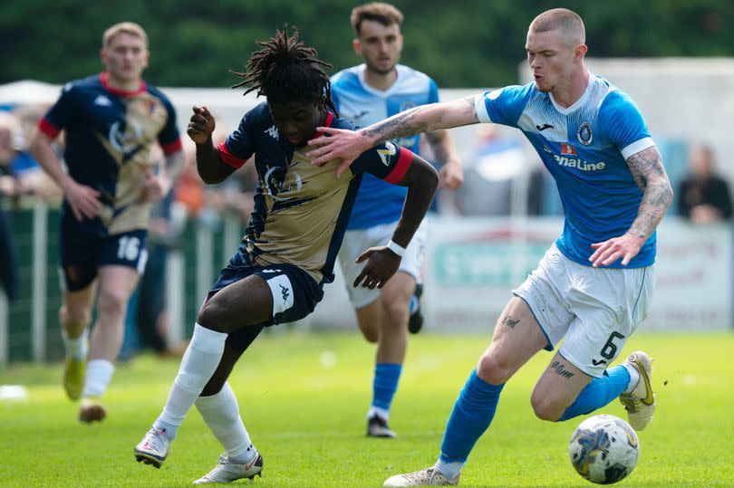 East Kilbride's Joao Balde and Stranraer's Chris McQueen tussle for possession as the sides clashed at Stair Park