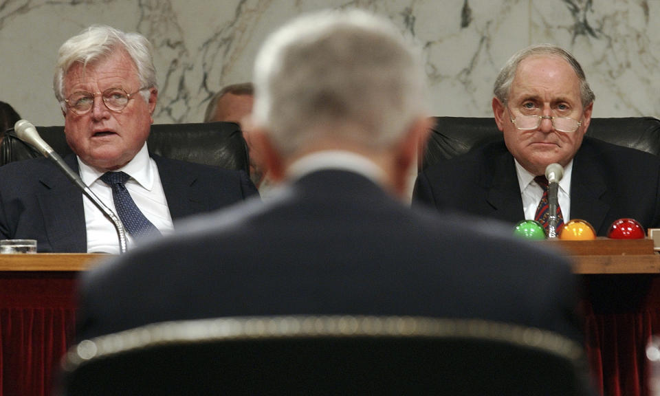 FILE - Chairman Sen. Carl Levin, D-Mich., right, and Sen. Edward Kennedy, D-Mass., left, listen to the testimony of retired Gen. Joseph Hoar, center, former commander in chief, U.S. Central Command, about U.S. policy on Iraq, Sept. 23, 2002, during a Senate Armed Services Committee hearing on Capitol Hill, in Washington. (AP Photo/Ken Lambert, File)