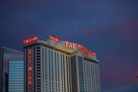 The Trump Taj Mahal Casino is illuminated at dusk in Atlantic City, New Jersey October 24, 2014. REUTERS/Mark Makela