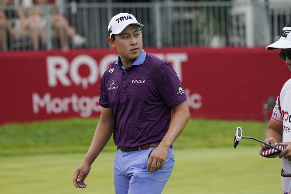 Dylan Wu walks off the 14th green during the third round of the Rocket Mortgage Classic golf tournament at Detroit Country Club, Saturday, July 1, 2023, in Detroit. (AP Photo/Carlos Osorio)