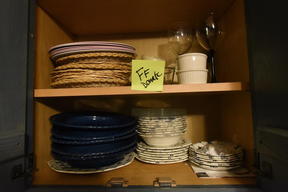 Dinnerware marked for donation to Fostering Further as Songbird Transitions helps a client pack and move to a smaller home.