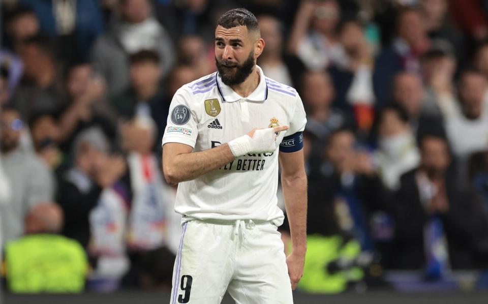 Karim Benzema of Real Madrid celebrates after scoring to give the side a 1-0 lead during the UEFA Champions League round of 16 leg two match between Real Madrid and Liverpool FC at Estadio Santiago Bernabeu - Getty Images/Jonathan Moscrop